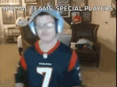 A Man Wearing Headphones And A Texans Jersey With The Number 7 GIF