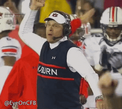A Man Wearing Headphones And A Vest That Says Auburn On It GIF