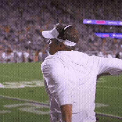A Man Wearing Headphones And A Visor That Says Georgia On It GIF