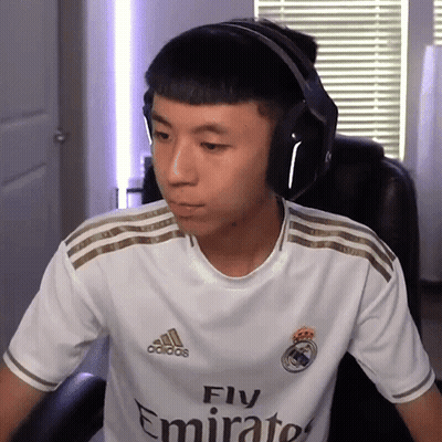 A Man Wearing Headphones And A White Fly Emirates Shirt GIF