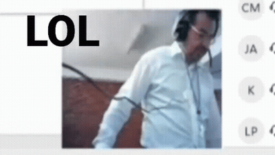 A Man Wearing Headphones And A White Shirt Is Standing In Front Of A Screen With The Words Lol On It . GIF