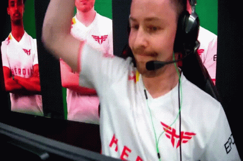 A Man Wearing Headphones And A White Shirt That Says Kef On It GIF