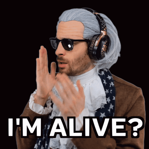 A Man Wearing Headphones And A Wig Says I 'M Alive GIF