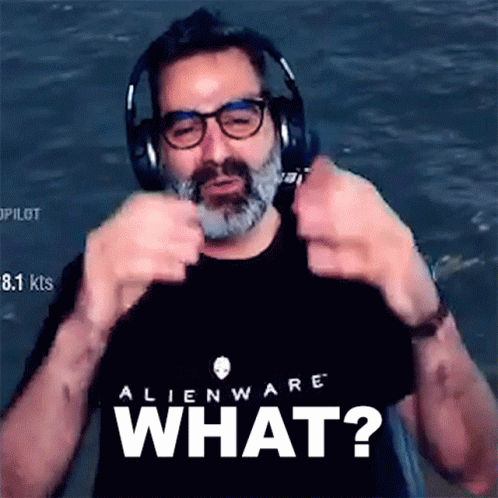 A Man Wearing Headphones And An Alienware T-Shirt Says What GIF