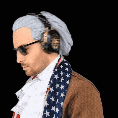 A Man Wearing Headphones And An American Flag Scarf Looks Down GIF