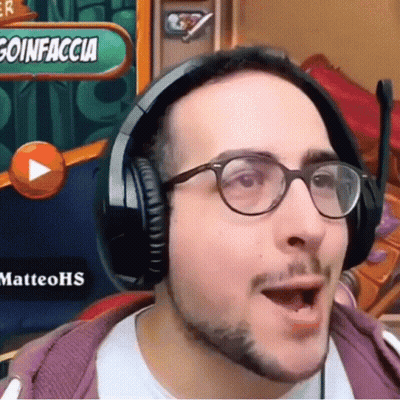 A Man Wearing Headphones And Glasses Is Playing A Video Game GIF