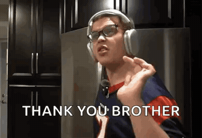 A Man Wearing Headphones And Glasses Is Singing A Song And Saying Thank You Brother . GIF