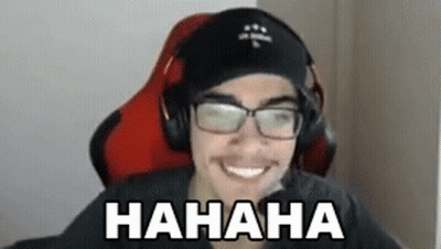 A Man Wearing Headphones And Glasses Is Sitting In A Chair And Laughing . GIF