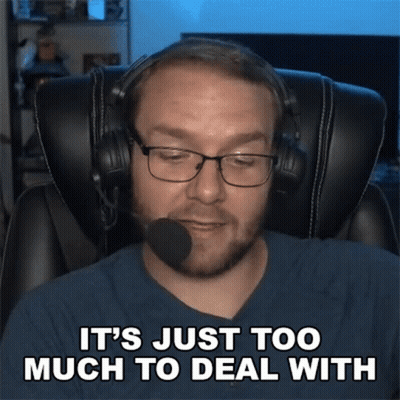A Man Wearing Headphones And Glasses Is Sitting In A Chair And Says It 'S Just Too Much To Deal With GIF