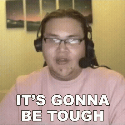 A Man Wearing Headphones And Glasses Is Sitting In Front Of A Computer Screen . GIF