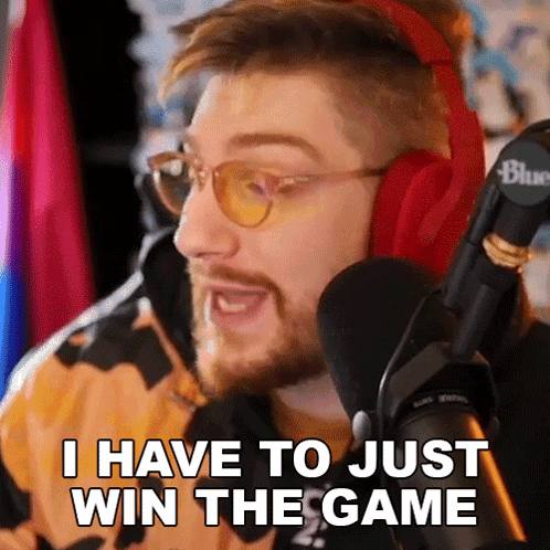 A Man Wearing Headphones And Glasses Is Talking Into A Microphone And Saying I Have To Just Win The Game GIF