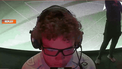 A Man Wearing Headphones And Glasses Is Watching A Replay On A Screen GIF