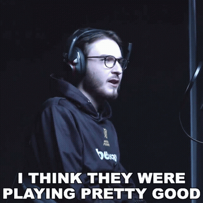 A Man Wearing Headphones And Glasses Says " I Think They Were Playing Pretty Good " In A Dark Room GIF