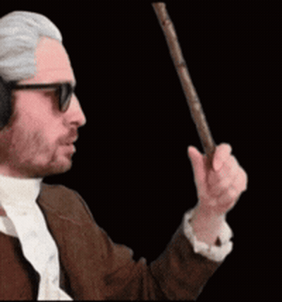 A Man Wearing Headphones And Sunglasses Is Holding A Cane GIF