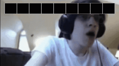 A Man Wearing Headphones And Sunglasses Is Looking At A Screen With Black Squares On It GIF