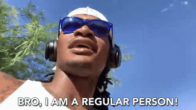 A Man Wearing Headphones And Sunglasses Is Saying Bro I Am A Regular Person GIF