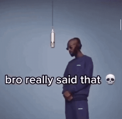 A Man Wearing Headphones And Sunglasses Is Talking Into A Microphone . GIF