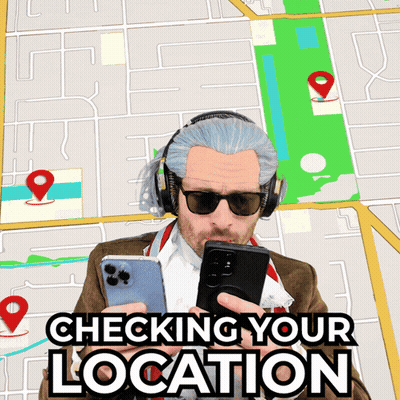 A Man Wearing Headphones And Sunglasses Looks At His Phone With The Words Checking Your Location Below Him GIF