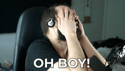 A Man Wearing Headphones Covering His Face With His Hands And The Words Oh Boy Written On The Bottom GIF
