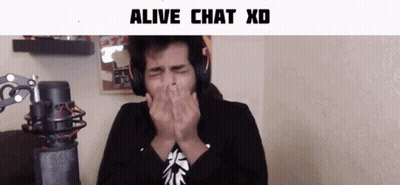 A Man Wearing Headphones Covering His Mouth With His Hands In Front Of A Microphone With The Words Alive Chat Xd Below H GIF