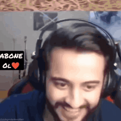 A Man Wearing Headphones Has A Sign Above His Head That Says ' Abone Ol ' GIF