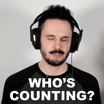A Man Wearing Headphones Has His Eyes Closed And Says Who 'S Counting GIF