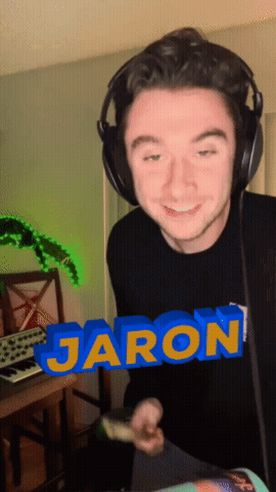 A Man Wearing Headphones Has The Name Jaron Written In Blue GIF