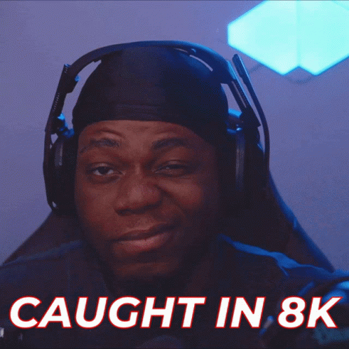 A Man Wearing Headphones Has The Words Caught In 8K Above Him GIF