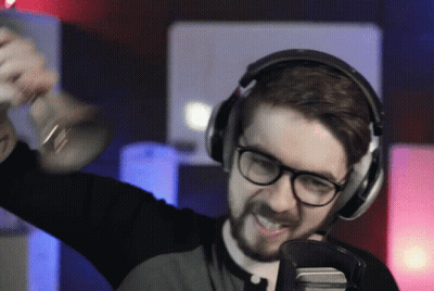 A Man Wearing Headphones Holds A Trumpet In His Hand GIF