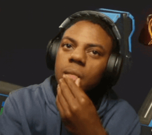 A Man Wearing Headphones Is Covering His Face GIF