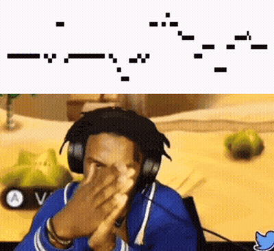A Man Wearing Headphones Is Covering His Face In Front Of A Computer Screen . GIF