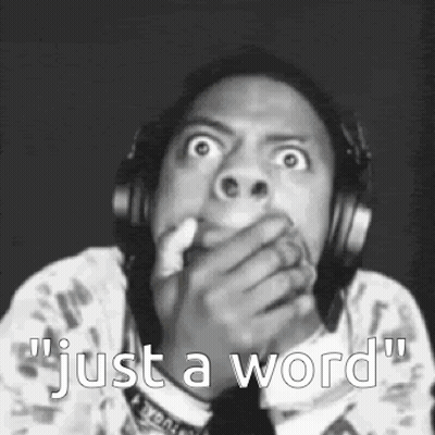 A Man Wearing Headphones Is Covering His Mouth With His Hand And Says `` Just A Word '' . GIF
