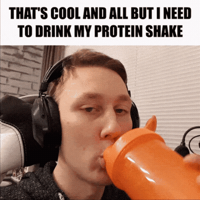 A Man Wearing Headphones Is Drinking From An Orange Bottle GIF