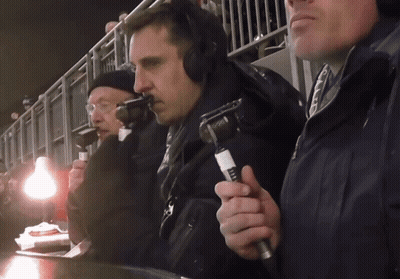 A Man Wearing Headphones Is Holding A Microphone That Says Fox On It GIF
