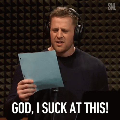 A Man Wearing Headphones Is Holding A Piece Of Paper And Saying " God I Suck At This " GIF