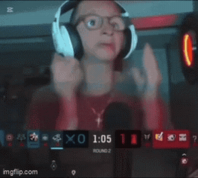 A Man Wearing Headphones Is Holding A Remote Control And Says To The Right Coming Through That Door Left Left .. GIF
