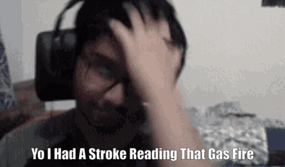 A Man Wearing Headphones Is Holding His Head And Says `` Yo I Had A Stroke Reading That Gas Fire '' GIF