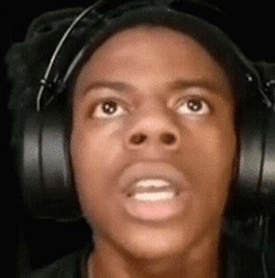 A Man Wearing Headphones Is Looking Up At The Camera . GIF