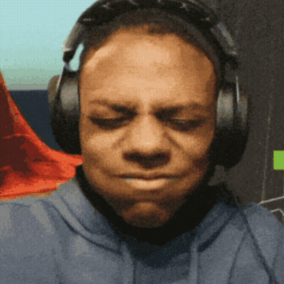 A Man Wearing Headphones Is Making A Face With His Eyes Closed GIF