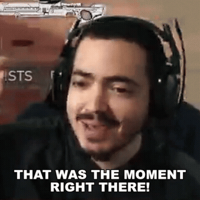A Man Wearing Headphones Is Making A Funny Face And Saying `` That Was The Moment Right There '' . GIF