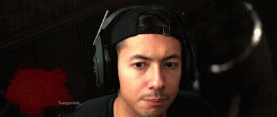 A Man Wearing Headphones Is Making A Funny Face In Front Of A Bloody Background That Says Tuesgeniuse GIF