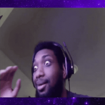 A Man Wearing Headphones Is Making A Funny Face In Front Of A Purple Background . GIF