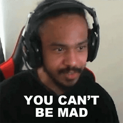 A Man Wearing Headphones Is Making A Funny Face . GIF