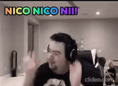A Man Wearing Headphones Is Making A Funny Face While Sitting In A Chair . GIF