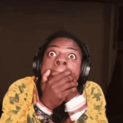 A Man Wearing Headphones Is Making A Surprised Face GIF