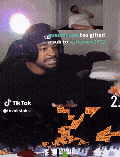A Man Wearing Headphones Is Playing A Video Game With A Caption That Says Guadeloupe Has Gifted A Sub GIF