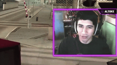 A Man Wearing Headphones Is Playing A Video Game With A Purple Overlay That Says ' Altos ' On It GIF