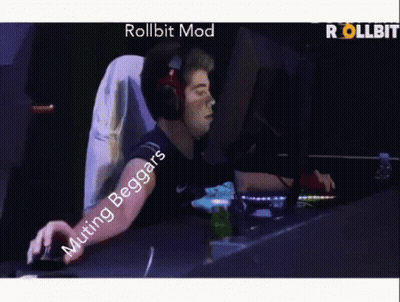 A Man Wearing Headphones Is Playing A Video Game With The Words Rollbit Mod Muting Beggars GIF