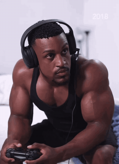 A Man Wearing Headphones Is Playing A Video Game With The Year 2018 On The Bottom GIF
