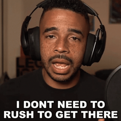 A Man Wearing Headphones Is Saying " I Don T Need To Rush To Get There " GIF